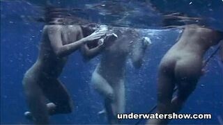 Three girls swimming nude in the sea