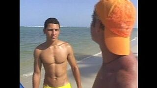 Hot gay threesome fucking on the beach